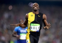 リオデジャネイロオリンピックの陸上・男子100m決勝で1位となり、笑顔を見せるボルト。(Photo by Shaun Botterill/Getty Images)