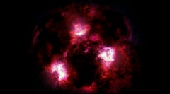 初期宇宙で誕生した巨大銀河の想像図。銀河本体は塵に隠れて、高温化した塵の輝きだけが移る。（c） James Josephides/Christina Williams/Ivo Labbe