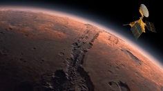 火星とNASAの探査機「マーズ・リコネッサンス・オービター」のイメージ。(c) 123rf