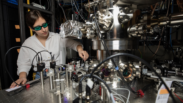 GTRI Research Scientist Darian Hartsell makes adjustments to an improved cryogenic vacuum chamber that helps reduce some common noise sources by isolating ions from vibrations and shielding them from magnetic field fluctuations. (Gtri.gatech.edu) GTRI Research Scientist Darian Hartsell makes adjustments to an improved cryogenic vacuum chamber that helps reduce some common noise sources by isolating ions from vibrations and shielding them from magnetic field fluctuations. (Gtri.gatech.edu)