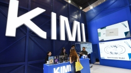 People visit the Moonshot AI stand, featuring Kimi K3, during the World Artificial Intelligence Conference in Shanghai on July 17, 2026. (Hector RETAMAL/WAIC)
