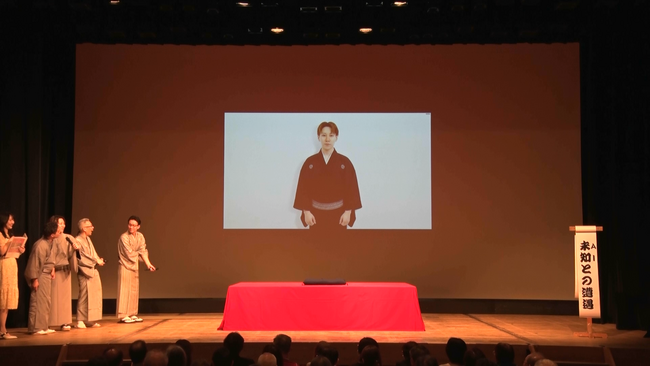 落語家・三遊亭ごはんつぶ氏のAIアバター「AIごはんつぶ」、公推協杯 全国若手落語家選手権「前夜祭」にてステージデビュー